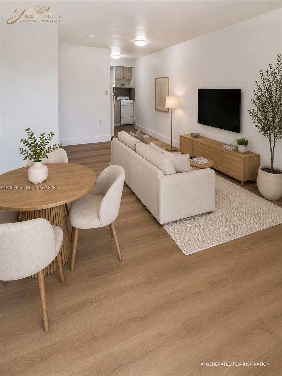 This AI-generated rendering shows an open-concept living and dining area with light wood flooring — 1465 W 28th St # 4, Hialeah FL 33010, HIALEAH, FL