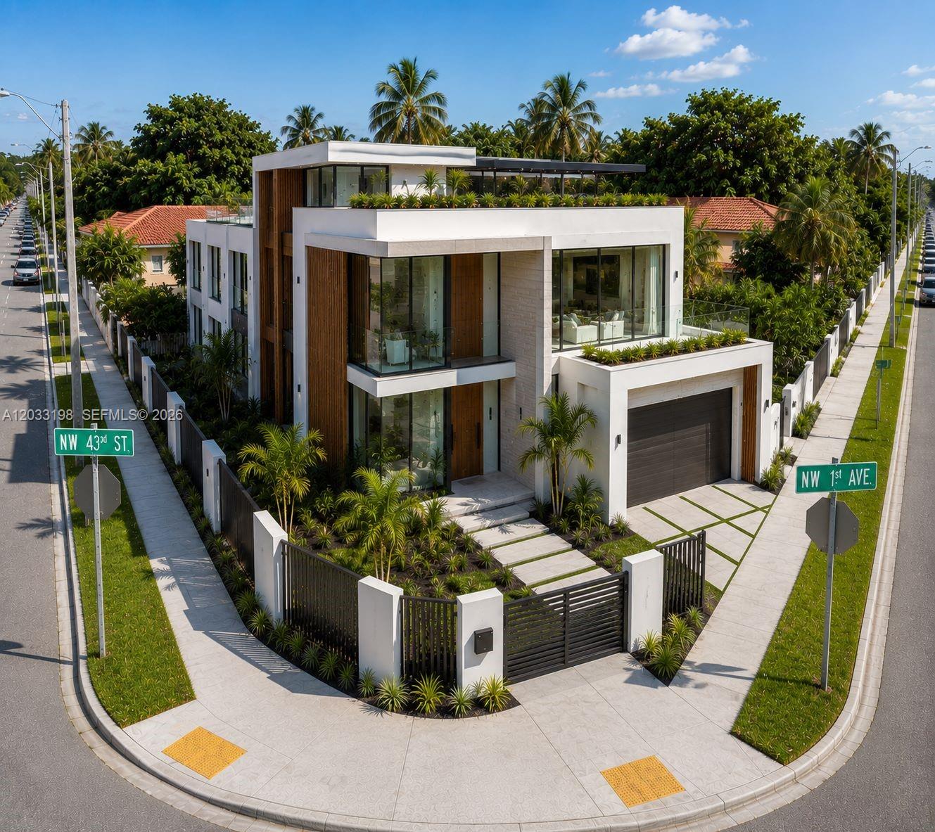 An aerial view of a modern two-story house with a flat roof and glass balconies — 4282 NW 1st Ave, Miami FL 33127, MIAMI, FL