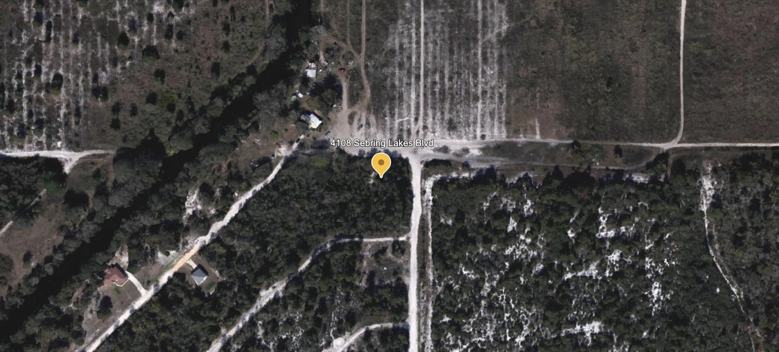 This is a satellite map view of a wooded, undeveloped plot of land — 4108 Sebring Lakes Boulevard, FL 33875, FL