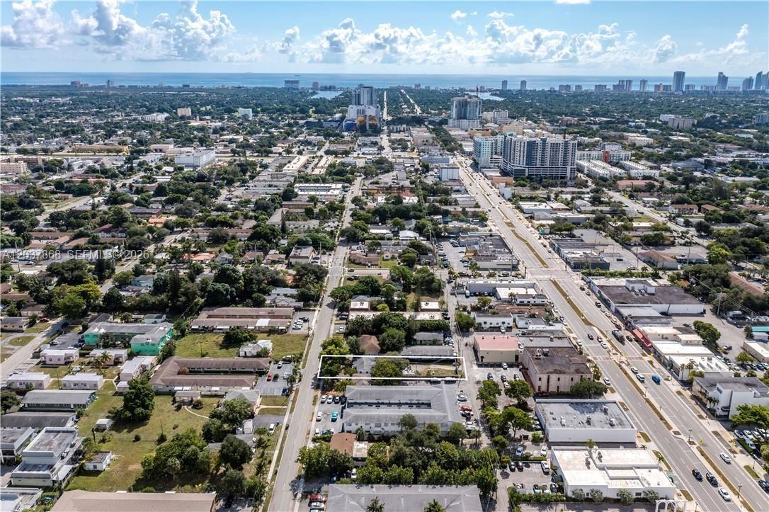 An aerial view shows a rectangular lot outlined in white within a suburban neighborhood — 2434 Polk St, Hollywood FL 33020, HOLLYWOOD, FL