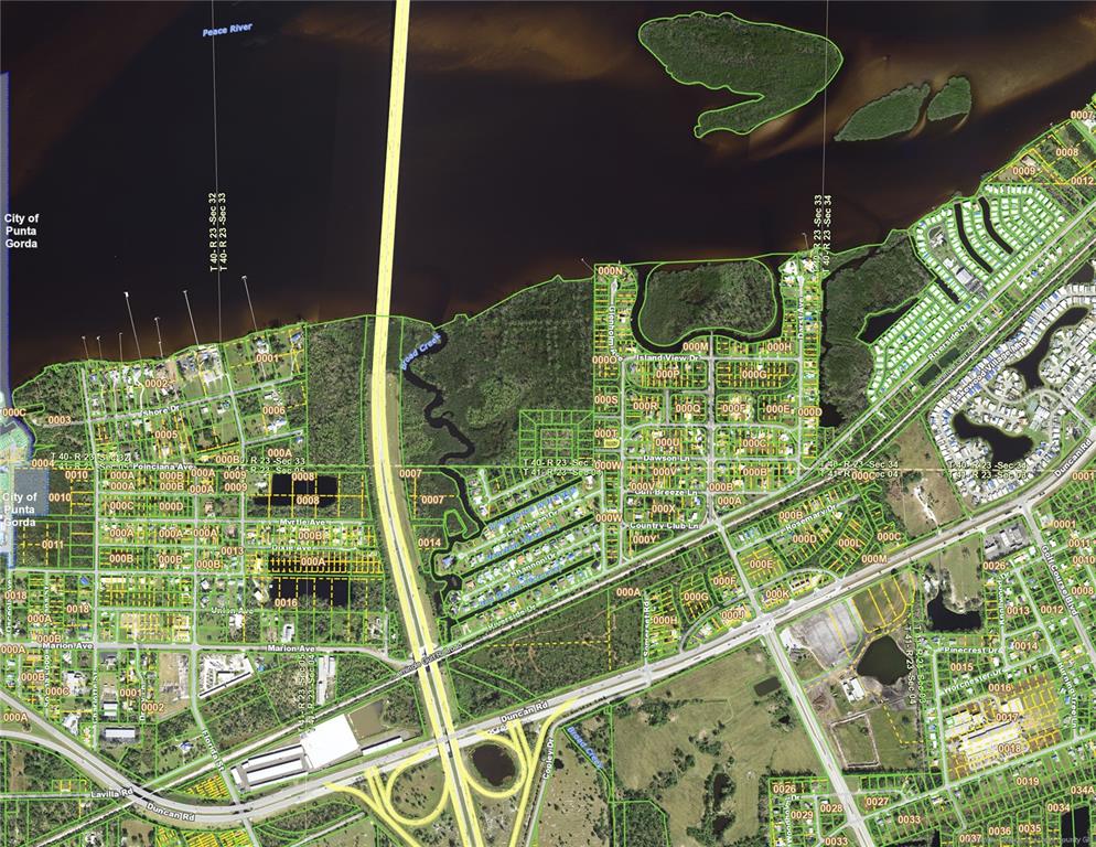 This is an aerial map showing residential neighborhoods, roads, and waterways in Punta Gorda — 141 GLENHOLM AVENUE, PUNTA GORDA, FL