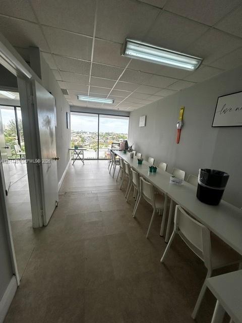 A long, narrow office space features a row of chairs along a white desk — 900 W 49th St Suite 420, Hialeah FL 33012, HIALEAH, FL