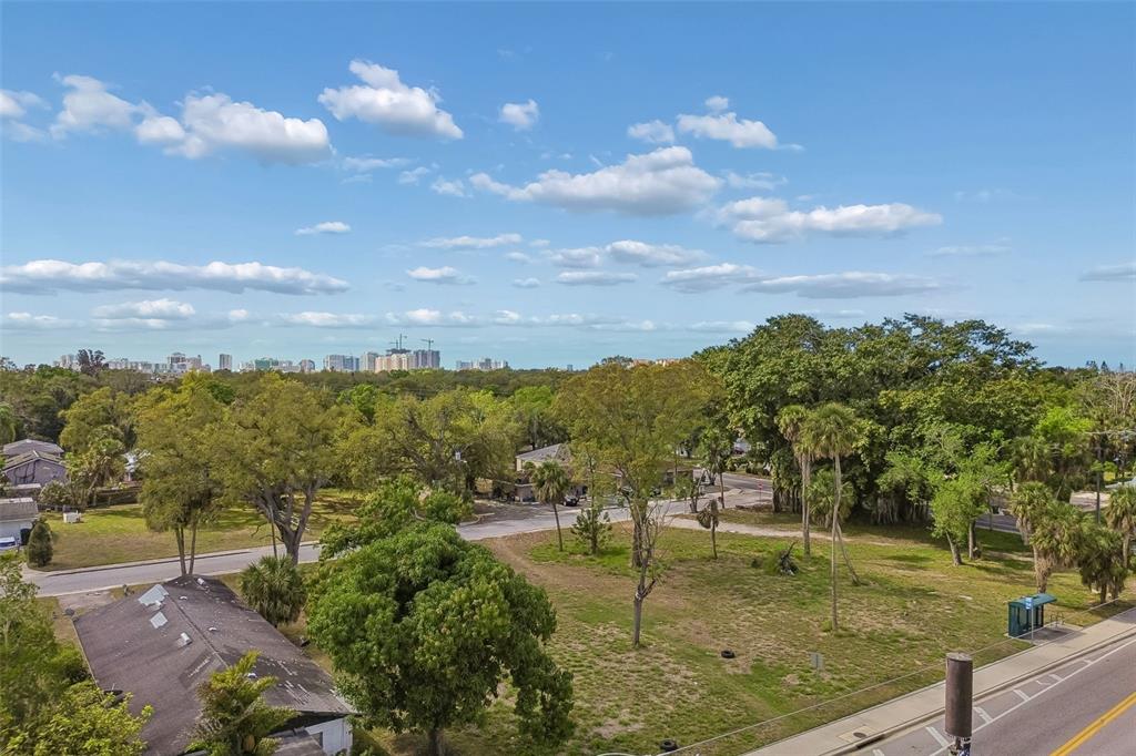 An elevated view of a grassy lot with scattered trees and a nearby road — 0 DR MARTIN LUTHER KING JR WAY, SARASOTA, FL
