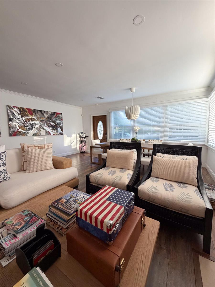 A living room features a white sofa, two dark wood armchairs, and a wooden coffee table — 521 Hampton Road, West Palm Beach FL 33405, WEST PALM BEACH, FL