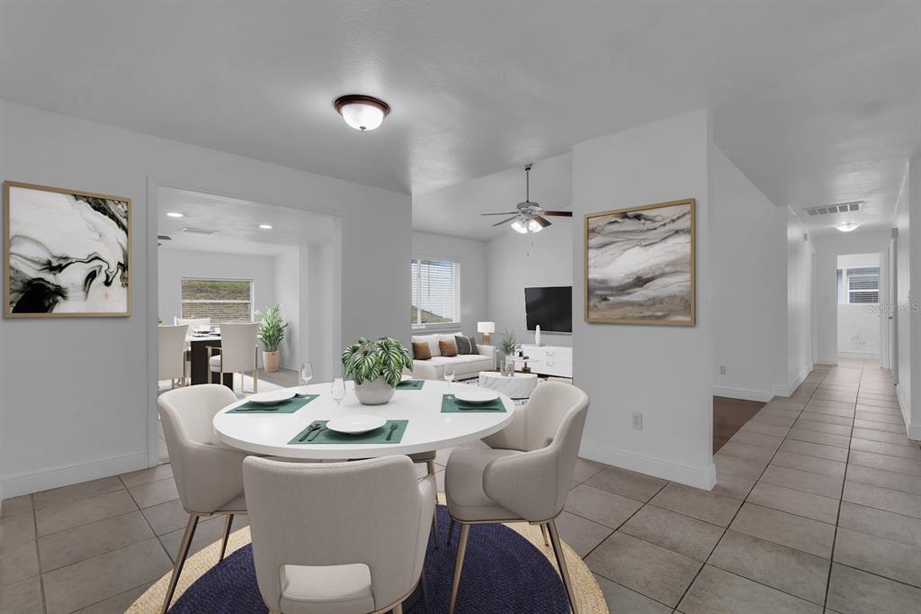 This is a digitally staged image of a dining area opening into a living room — 3638 JERICHO DRIVE, CASSELBERRY, FL