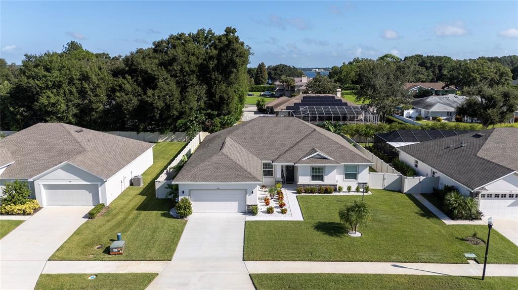 An aerial view shows a suburban house with a gray roof and a front lawn — 252 SAMANTHA AVE,, AUBURNDALE, FL