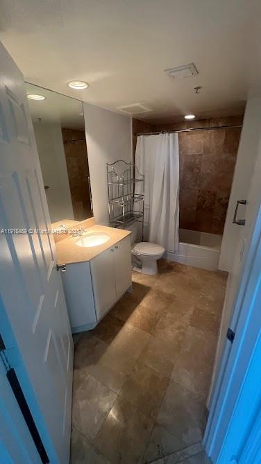 A bathroom features a vanity with a sink, a toilet, and a shower-tub combination — 1745 E Hallandale Beach Blvd # 1807W, Hallandale Beach FL 33009, HALLANDALE BEACH, FL