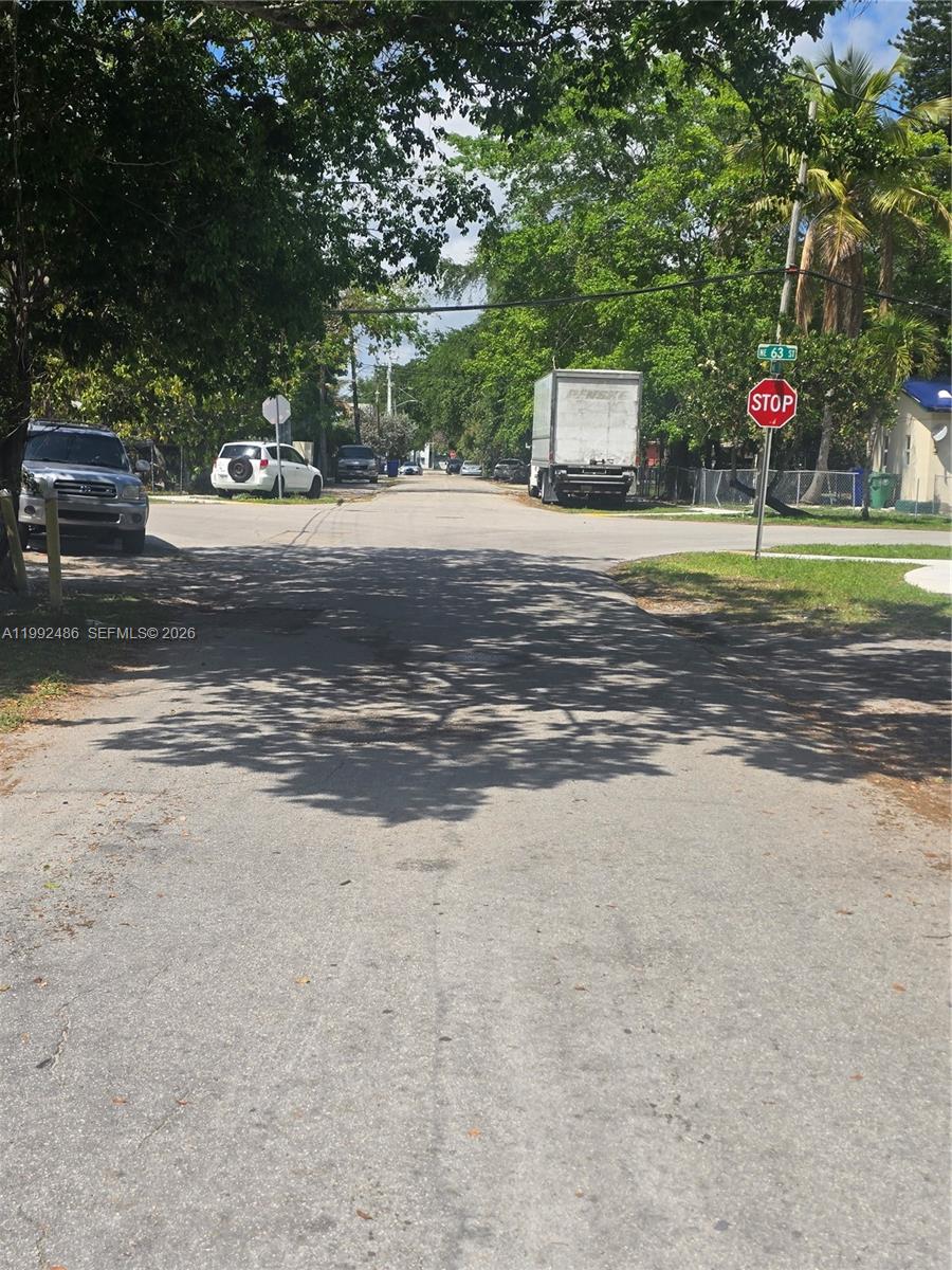 A view of a residential street intersection with a stop sign and parked vehicles — 6231 NE 1st Ave # 2, Miami FL 33138, MIAMI, FL