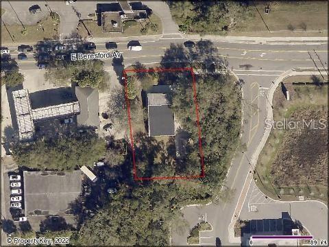 This aerial map view shows a rectangular property lot outlined in red with a building — 106 E BERESFORD AVENUE, DELAND, FL