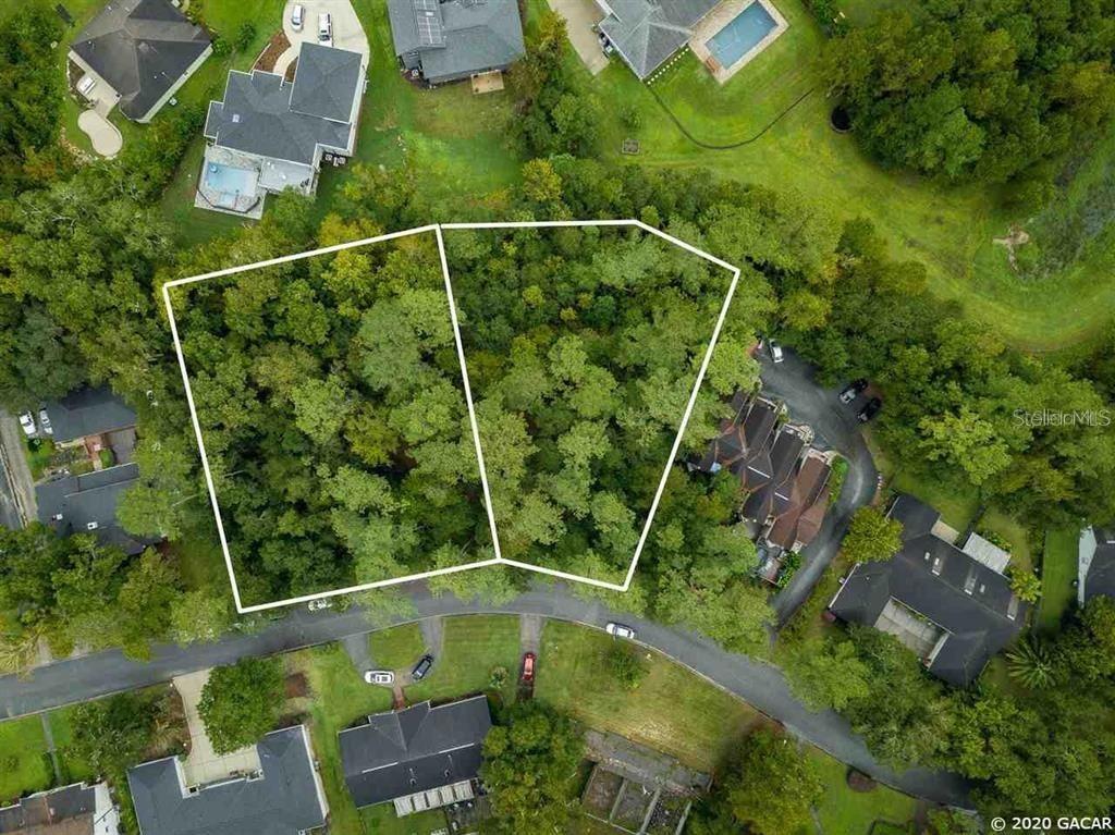 An aerial view shows two adjacent, wooded, undeveloped residential lots outlined in white — 2804 AND 2730 NW 104TH COURT, GAINESVILLE, FL