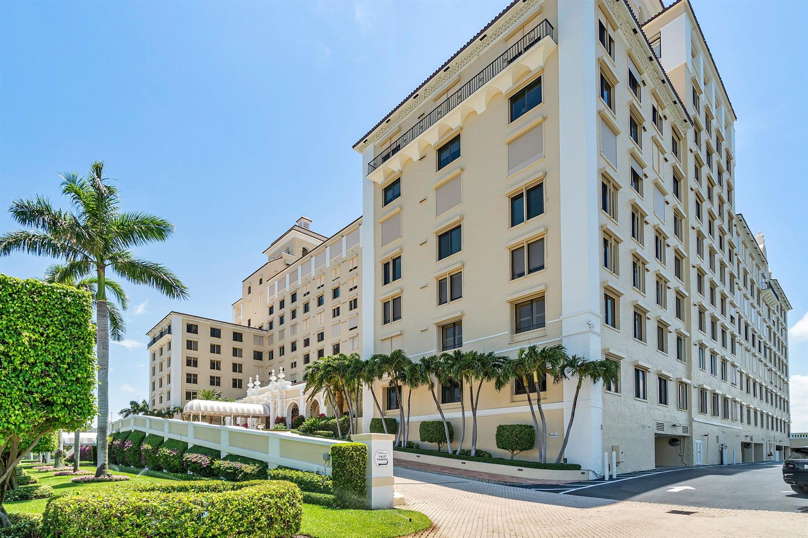 A large, multi-story beige hotel building with a valet parking entrance and palm trees — 150 Bradley Place # 101, Palm Beach FL 33480, PALM BEACH, FL