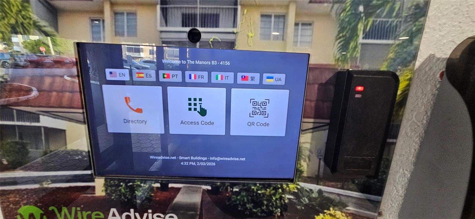A digital intercom system with a touchscreen display is mounted on a building exterior wall — 4156 Inverrary Drive # 204, Lauderhill FL 33319, LAUDERHILL, FL