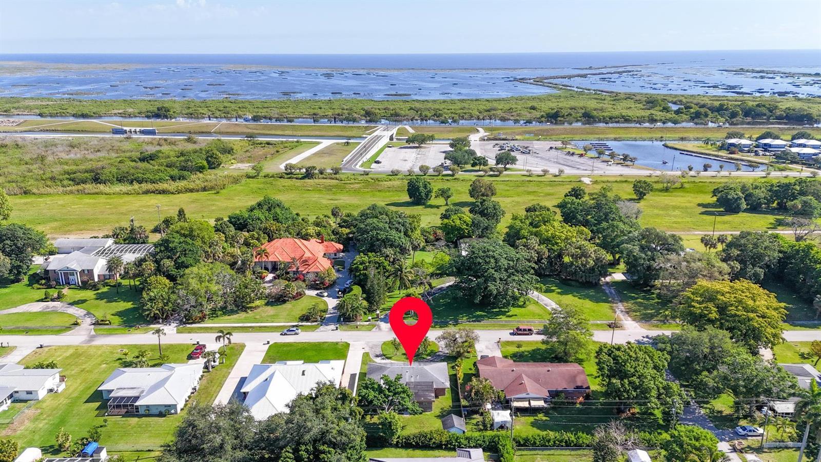 An aerial view shows a residential neighborhood with a red pin marking a house — 534 E Del Monte Avenue, Clewiston FL 33440, CLEWISTON, FL