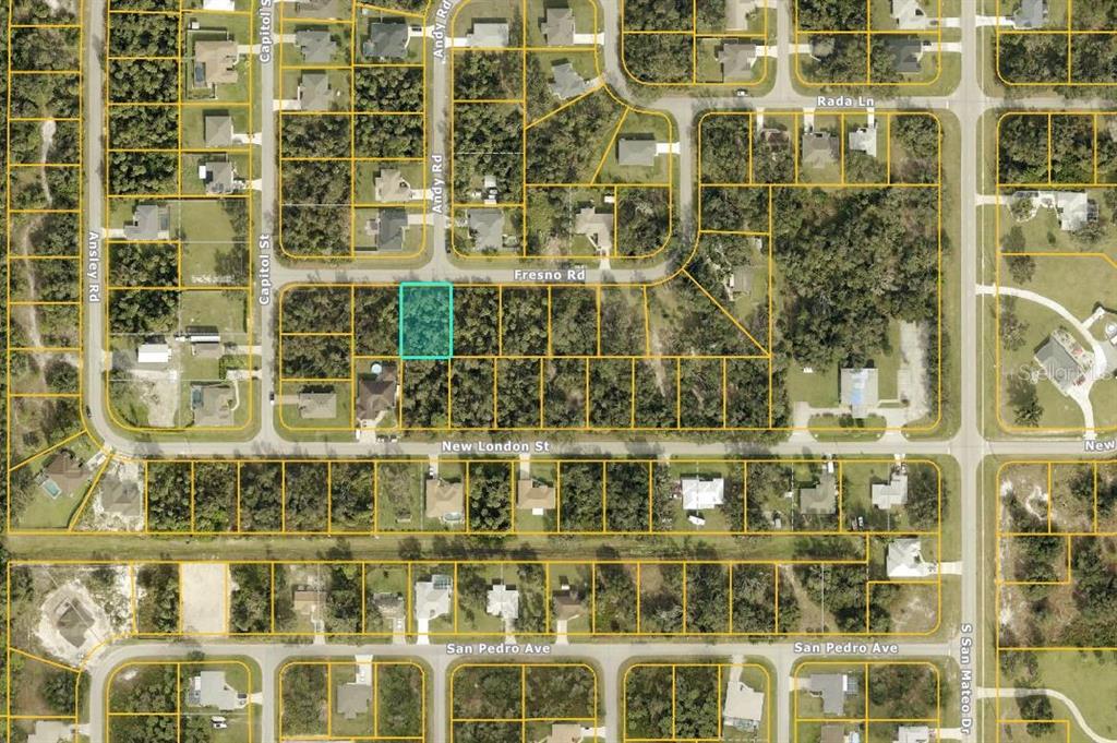 This is an aerial map showing a highlighted vacant residential lot in a suburban neighborhood — FRESNO ROAD, NORTH PORT, FL