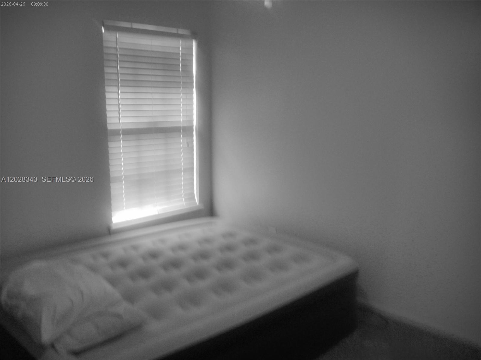 A bedroom features a mattress on the floor and a window with closed blinds — 1641 spring oaks ln, Jacksonville FL 32221, JACKSONVILLE, FL