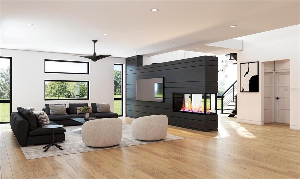 This is a rendering of a modern living room with a black fireplace partition wall — 2309 N RIVERSIDE DRIVE, TAMPA, FL