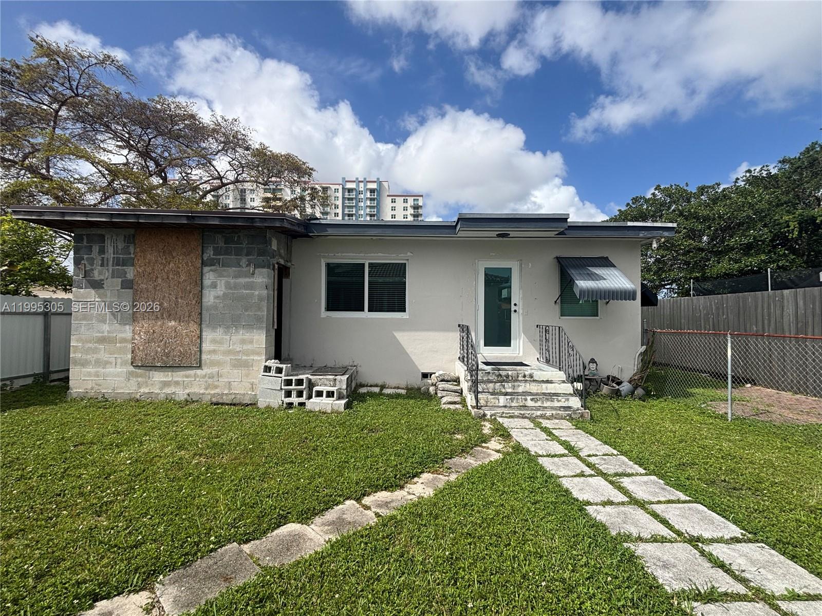 A single-story house features a concrete block section, a white stucco facade, and a walkway — 2951 SW 23rd St # 2, Miami FL 33145, MIAMI, FL