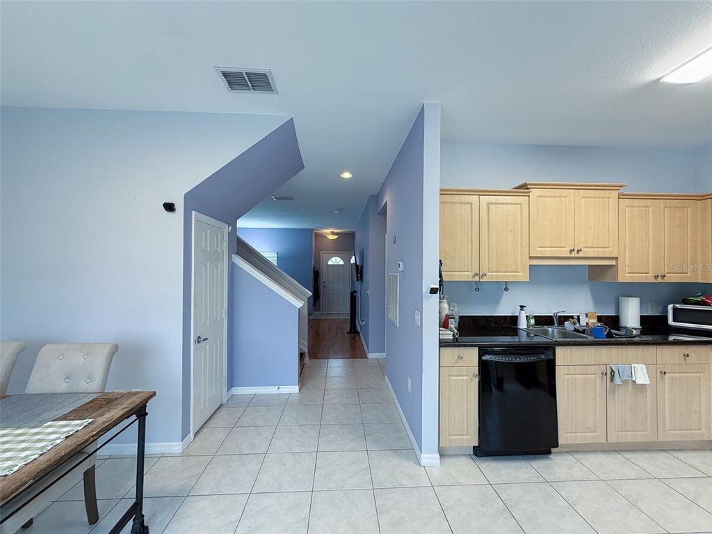 A small bathroom features a pedestal sink, a toilet, and a towel rack — 7669 PLANTATION CIRCLE UNIT 7669, BRADENTON, FL