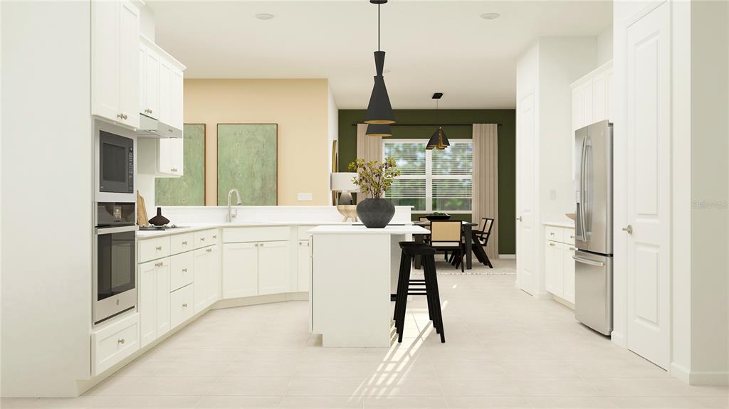 This is a rendering of a modern kitchen with white cabinetry, stainless appliances, and an island — 5938 MOUND KEY RUN, LAKEWOOD RANCH, FL