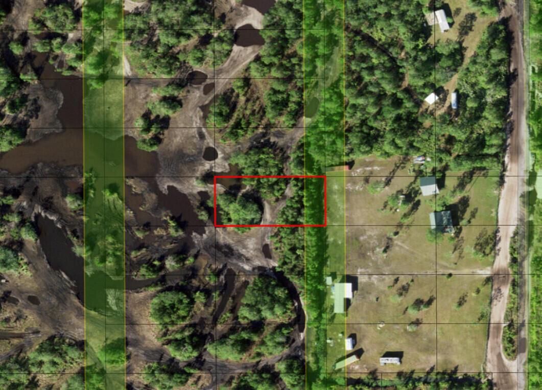 An aerial map view shows a rectangular property outlined in red amidst wooded, marshy terrain — 0 Holopaw Groves Road, FL 34772, FL