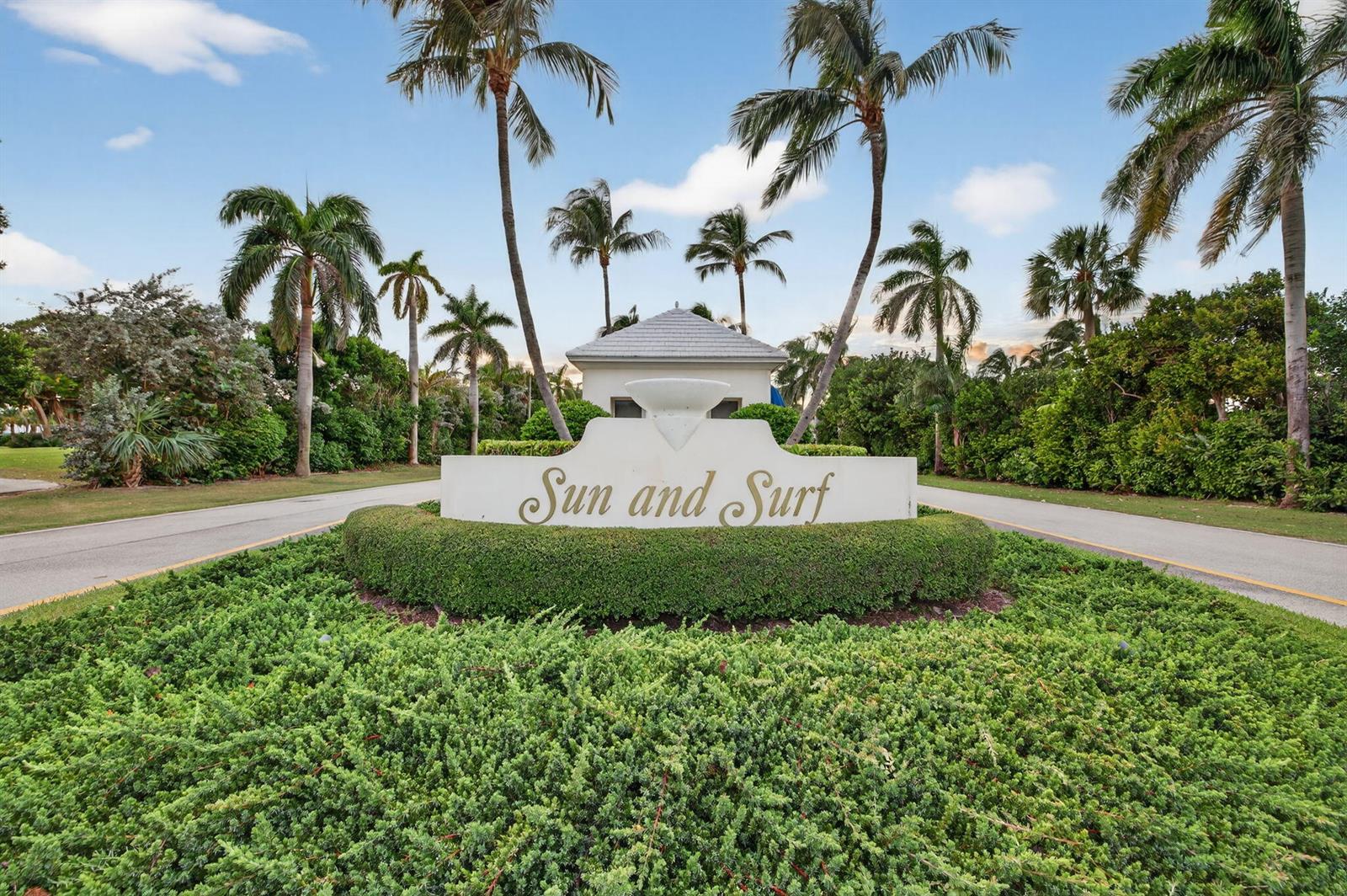 A white monument sign reading Sun and Surf sits in a landscaped garden with palm trees — 1201 Marble Way, Boca Raton FL 33432, BOCA RATON, FL