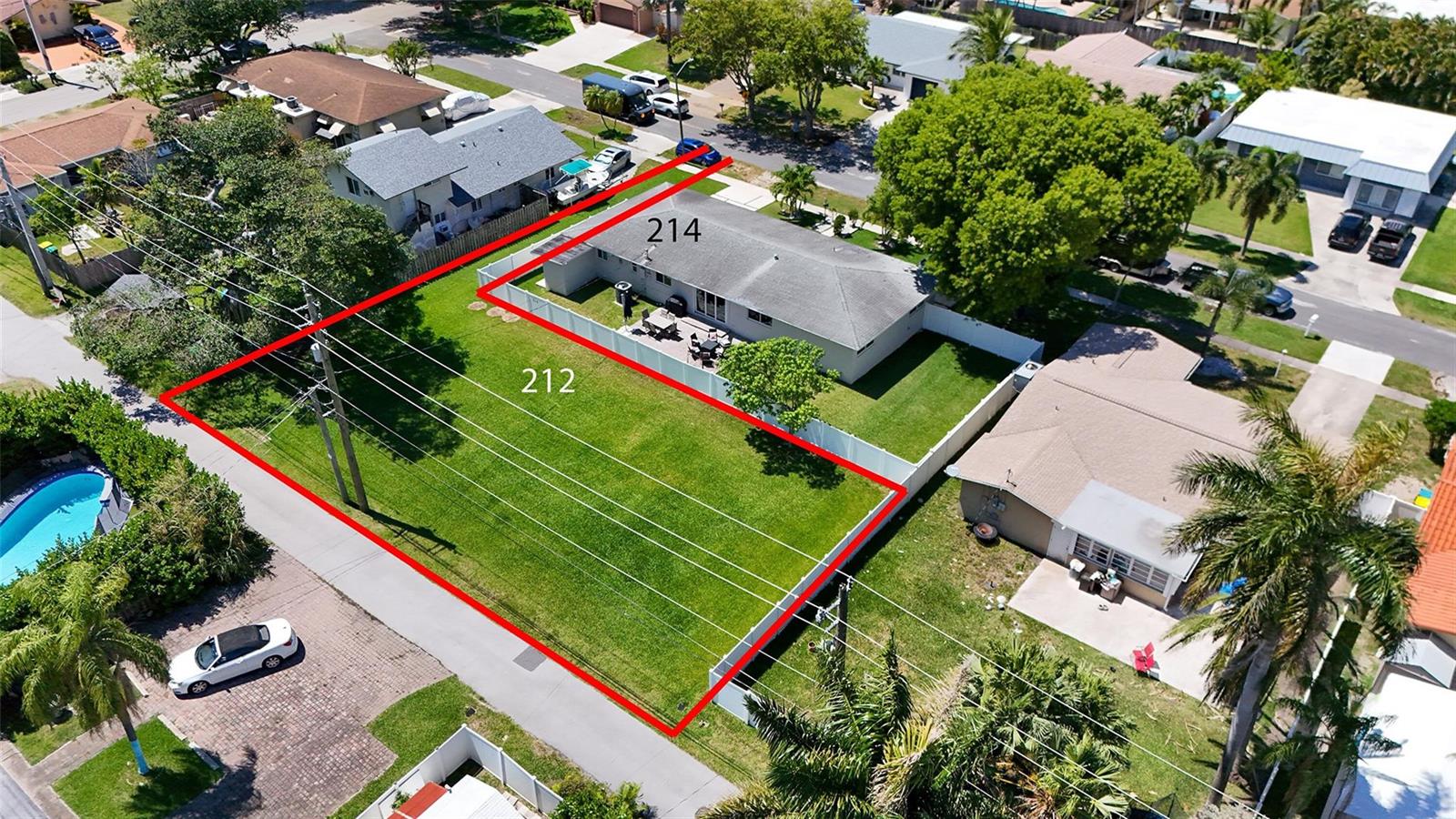 An aerial view shows a residential property with a house and an adjacent vacant lot — 212 SE 5th Street, Dania Beach FL 33004, DANIA BEACH, FL