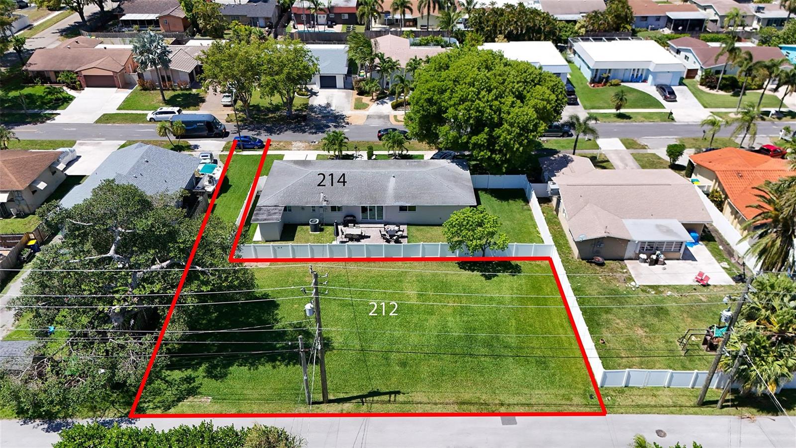 An aerial view shows a residential house and an adjacent vacant lot outlined in red — 212 SE 5th Street, Dania Beach FL 33004, DANIA BEACH, FL
