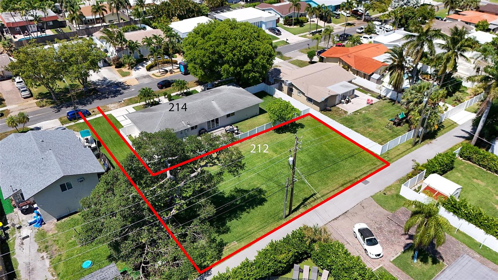 An aerial view shows a vacant residential lot outlined in red next to a house — 212 SE 5th Street, Dania Beach FL 33004, DANIA BEACH, FL