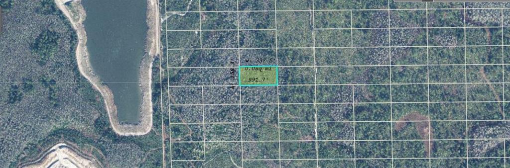 This is an aerial map showing a highlighted rectangular plot of land near a lake — DILL ROAD, ORLANDO, FL