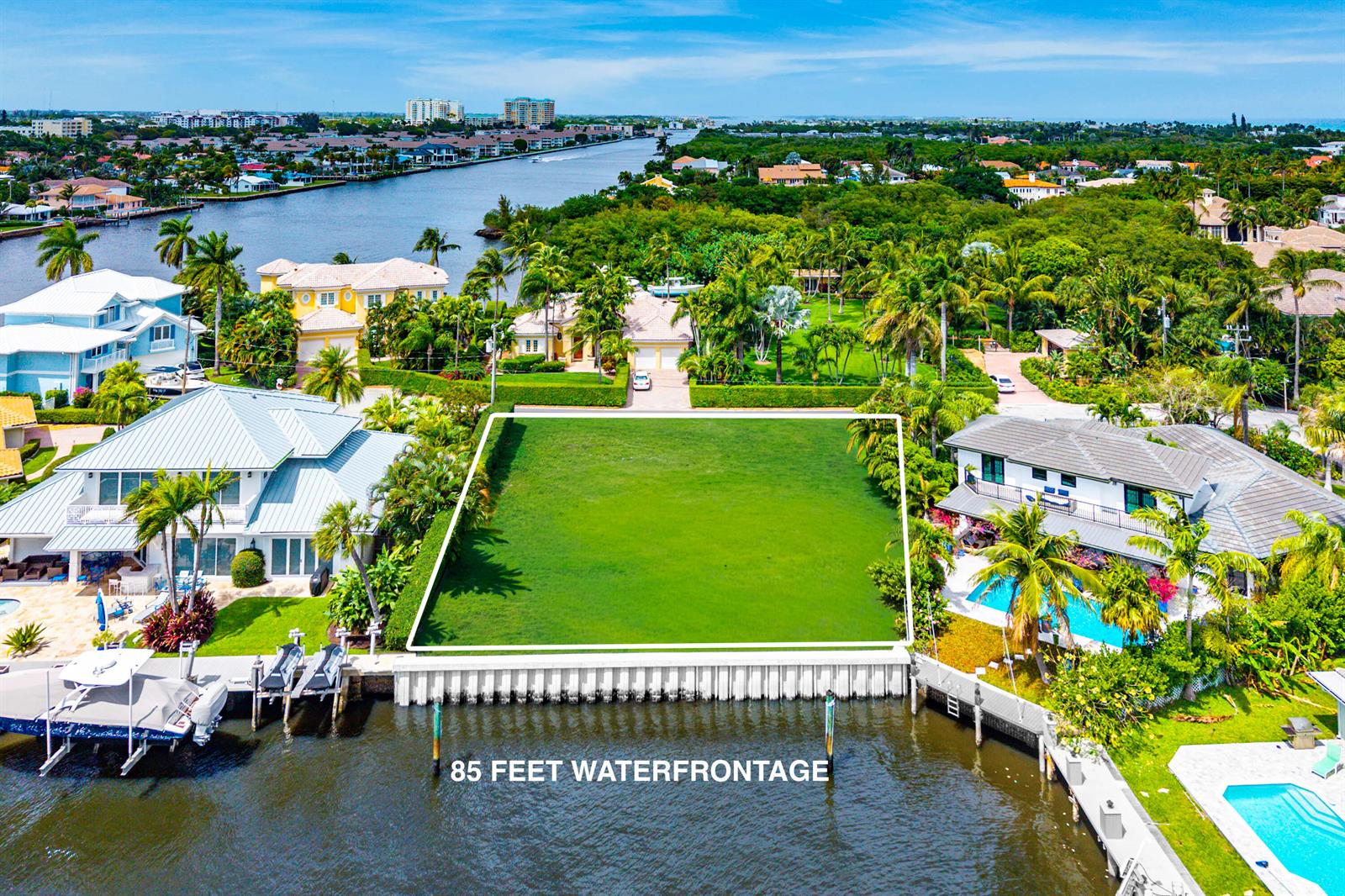 An aerial view shows a vacant waterfront lot situated between two large residential houses — 29 Hibiscus Way, Ocean Ridge FL 33435, OCEAN RIDGE, FL