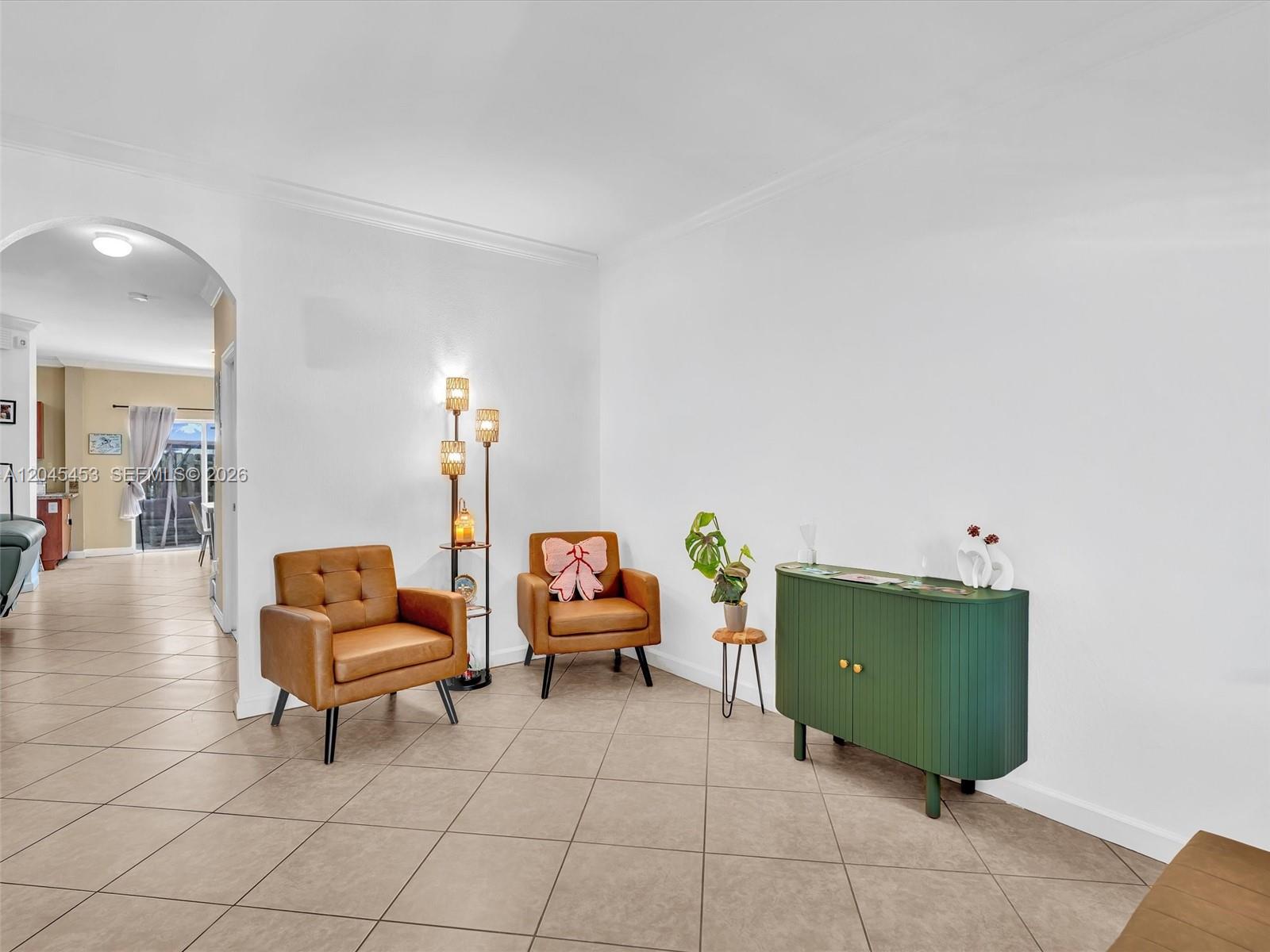 A living area features two brown leather chairs, a green cabinet, and a floor lamp — 8887 SW 225th St, Cutler Bay FL 33190, CUTLER BAY, FL
