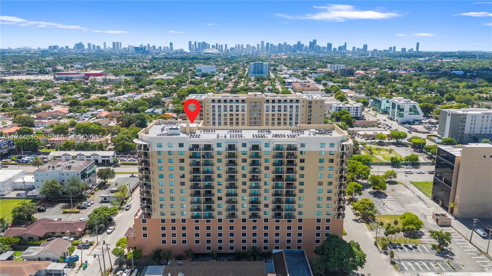 An aerial view shows a multi-story residential building with a red location pin — 4242 NW 2nd St # 1609, Miami FL 33126, MIAMI, FL