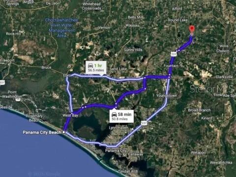 This map shows two driving routes between Panama City Beach and a location further north — ADAMS DRIVE, ALFORD, FL