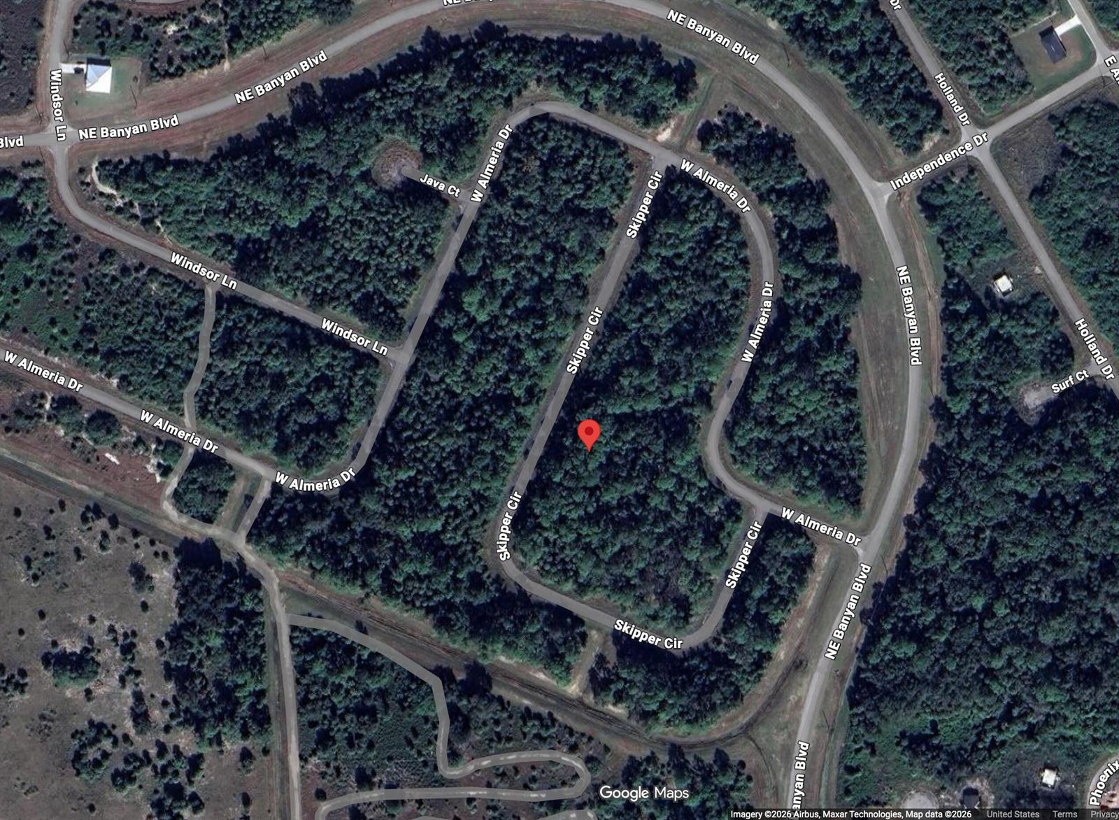 This is a satellite map view of a wooded residential area with paved streets — 425 Skipper Terrace, FL 33935, FL