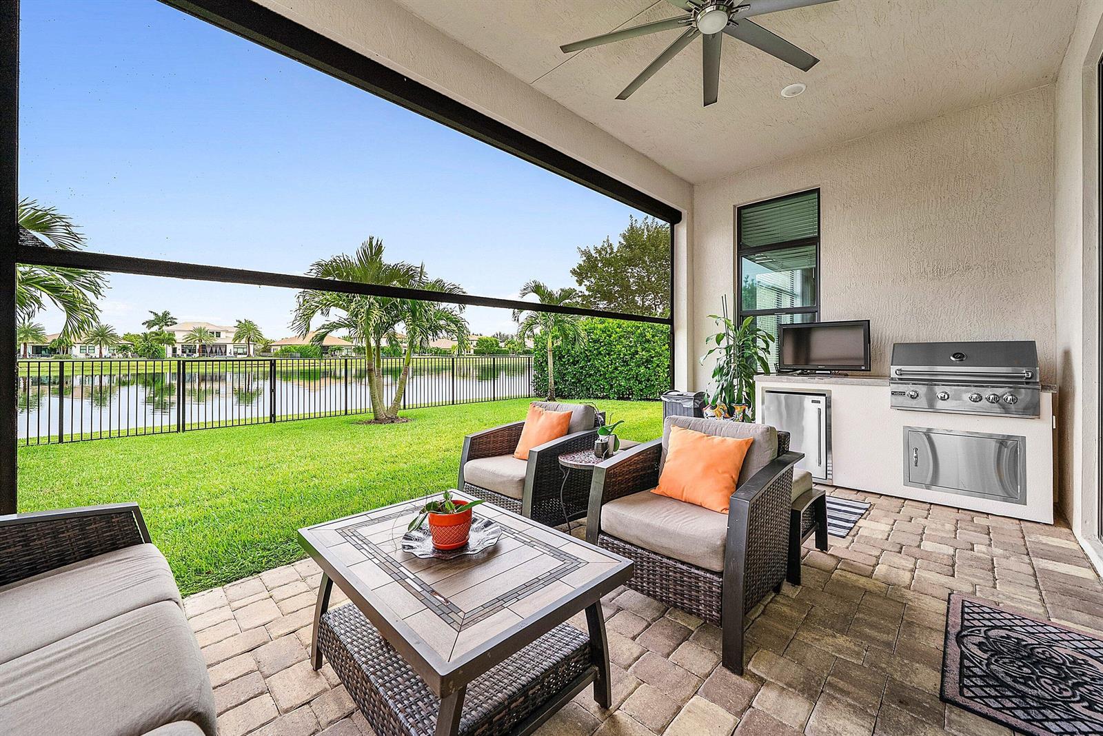 A two-story house with a stone facade, a two-car garage, and a palm tree — 8884 Grand Prix Lane, Boynton Beach FL 33472, BOYNTON BEACH, FL
