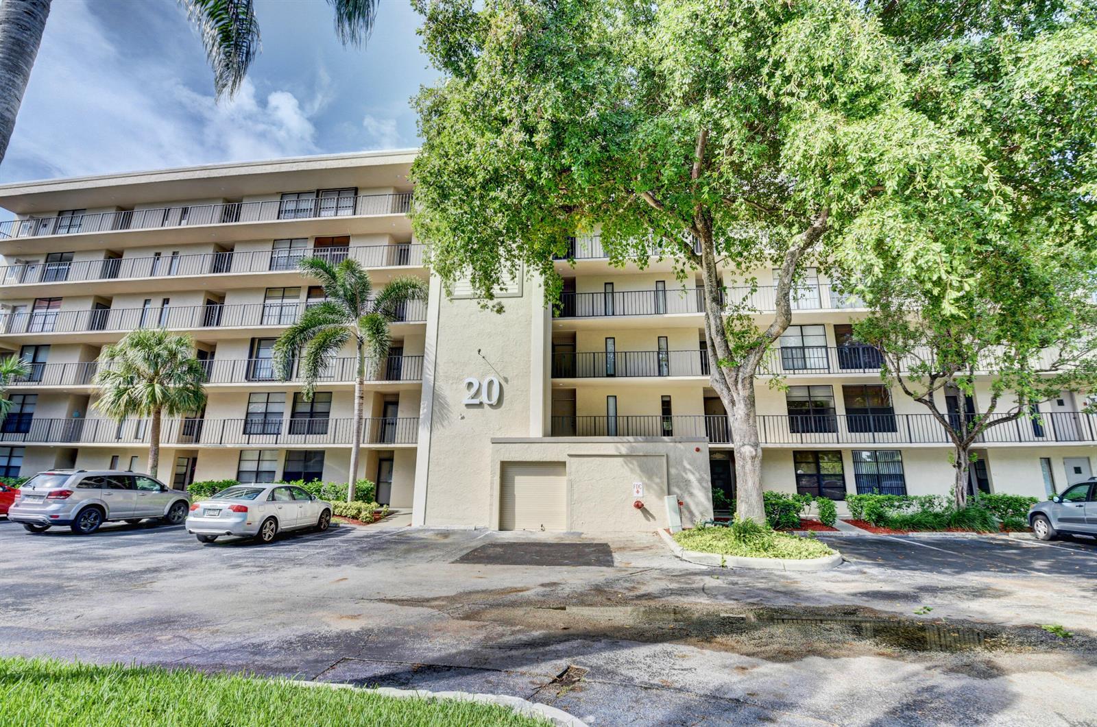 A multi-story apartment building with balconies and a parking lot in front — 20 Royal Palm Way # 503, Boca Raton FL 33432, BOCA RATON, FL