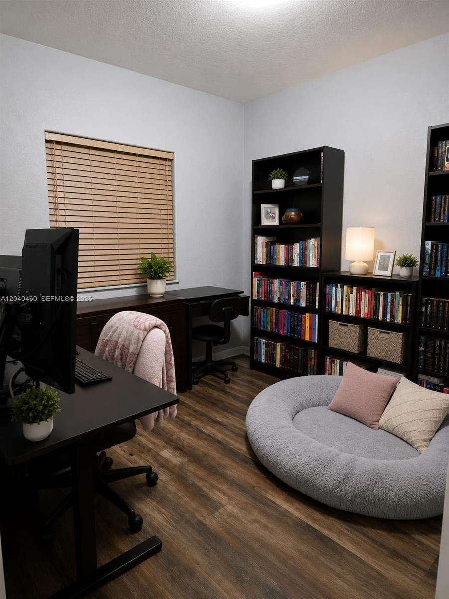 A home office features a desk, bookshelves, and a large round floor cushion — 4420 SW 163rd Ct, Miami FL 33185, MIAMI, FL