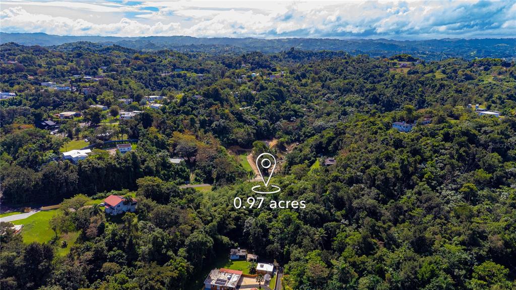 An aerial view shows a wooded lot marked with a location pin and acreage — URB. HACIENDAS DEL DORADO CALLE GUAYACAN A30, TOA ALTA, PR