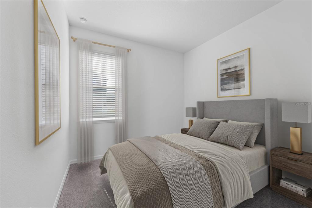 A bedroom with a grey upholstered bed, two nightstands, and a window with blinds — 5750 STOCKADE BOULEVARD, ST CLOUD, FL