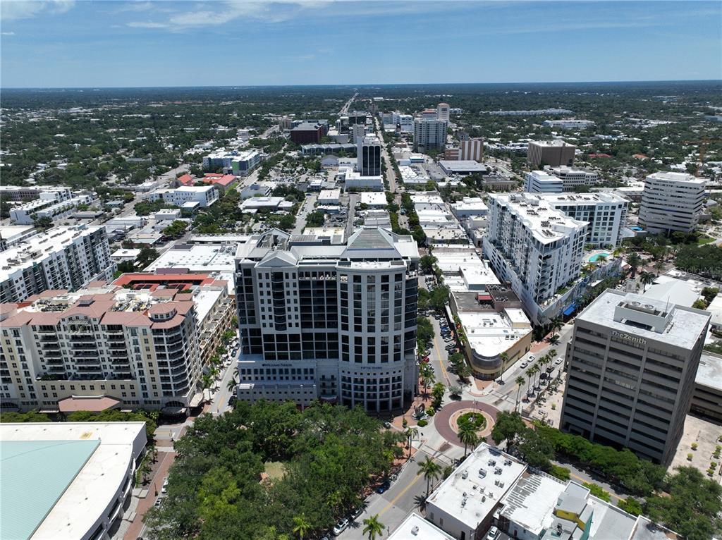An aerial view of a city skyline featuring mid-rise and high-rise buildings and streets — 50 CENTRAL AVENUE UNIT 970, SARASOTA, FL