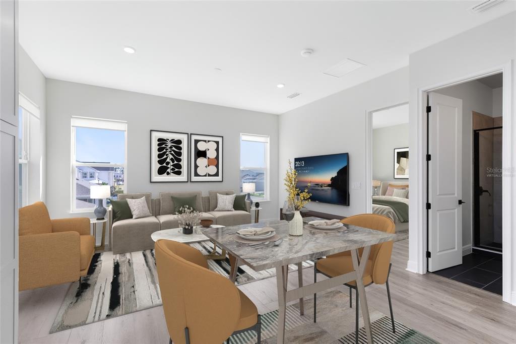 This virtual rendering shows a living and dining area with light wood floors and furniture — 10105 HASSELMANN ALLEY, ORLANDO, FL