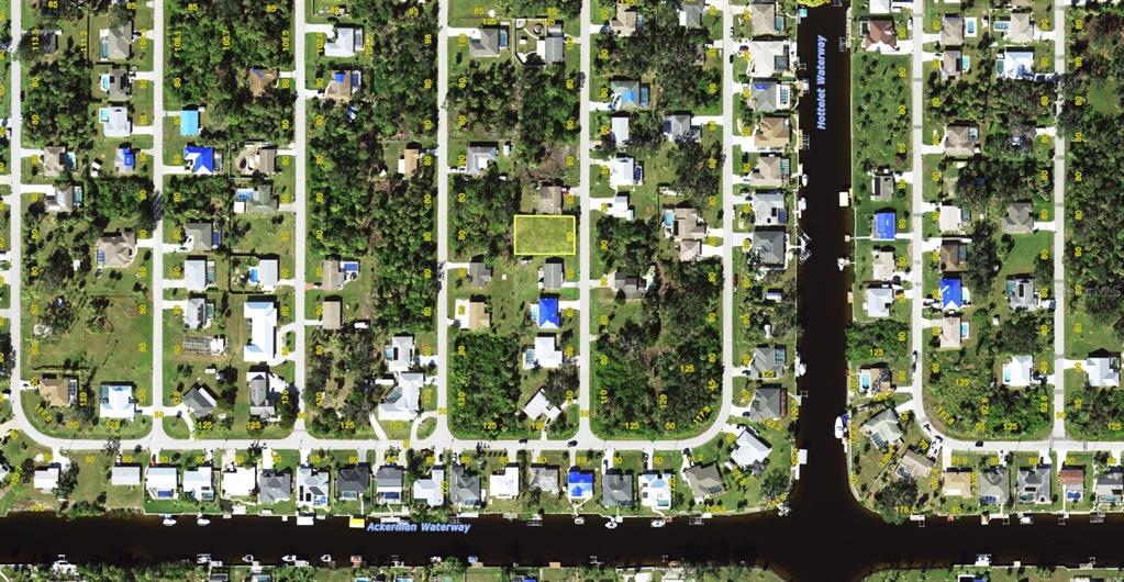 An aerial map view shows a vacant residential lot highlighted in yellow within a neighborhood — 4371 CONCERT STREET, PORT CHARLOTTE, FL
