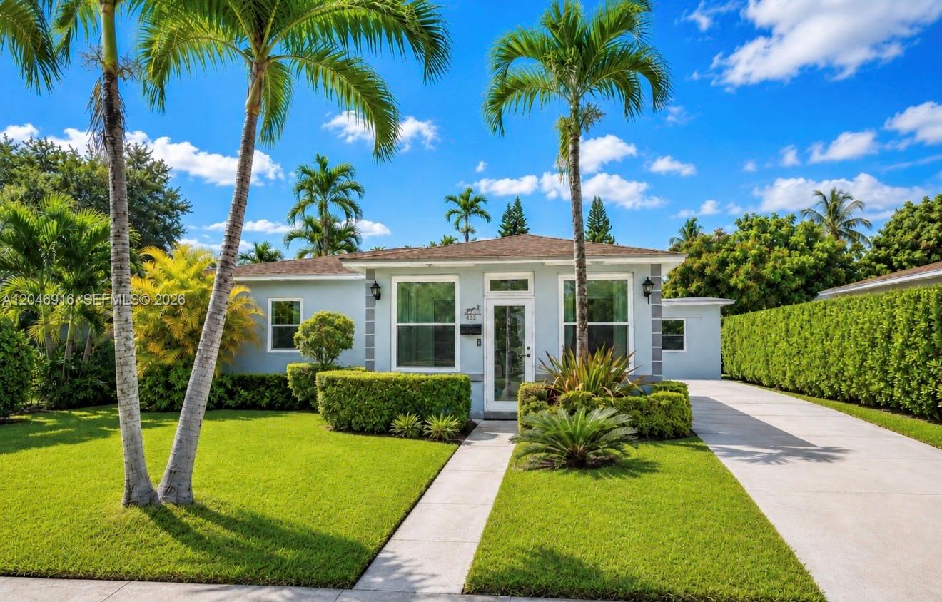 A light blue single-story house with a concrete driveway and palm trees in the front yard — 432 NW 103rd St # 1, Miami FL 33150, MIAMI, FL