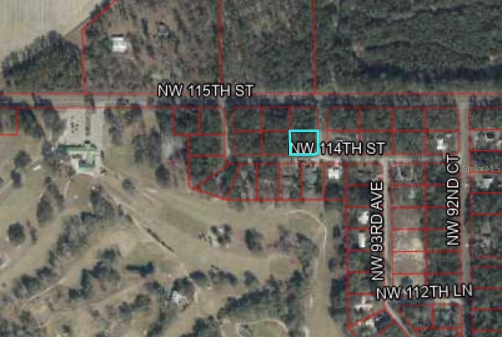 This is an aerial map showing a highlighted plot of land in a residential area — TBD NW 114TH STREET, CHIEFLAND, FL