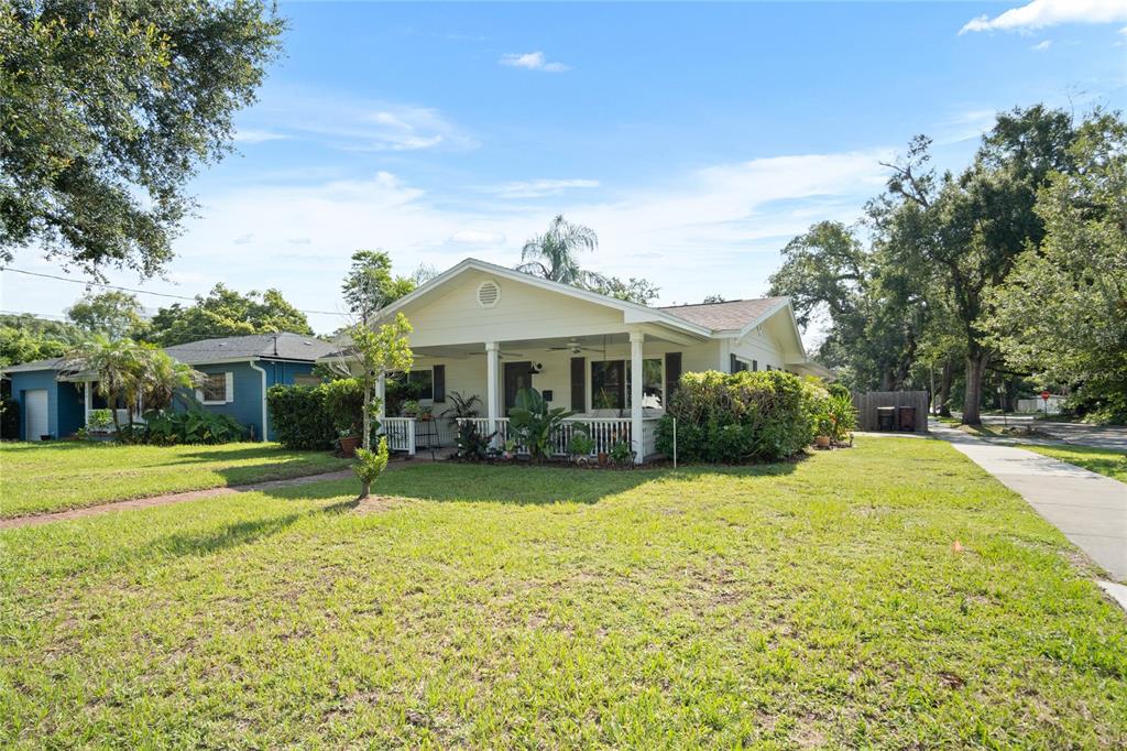 A light-colored, single-story house with a front porch sits on a grassy lot — 501 MERIDALE AVENUE, ORLANDO, FL