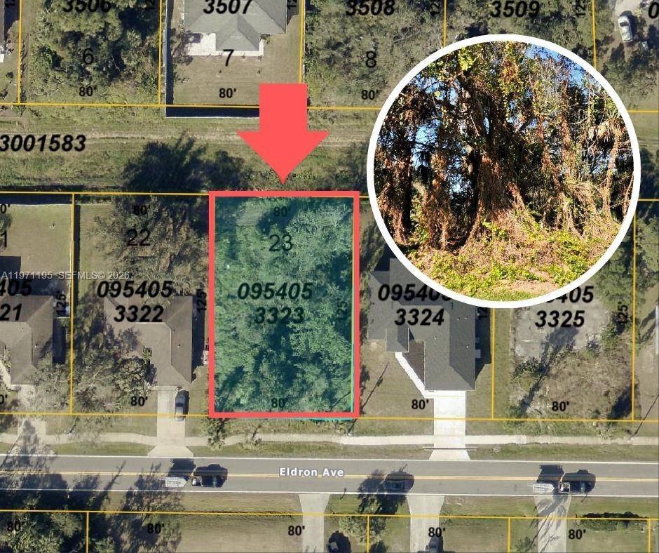 This is an aerial map showing a vacant, tree-covered residential lot highlighted in red — Eldron ave north ple, Sarasota FL 34286, SARASOTA, FL