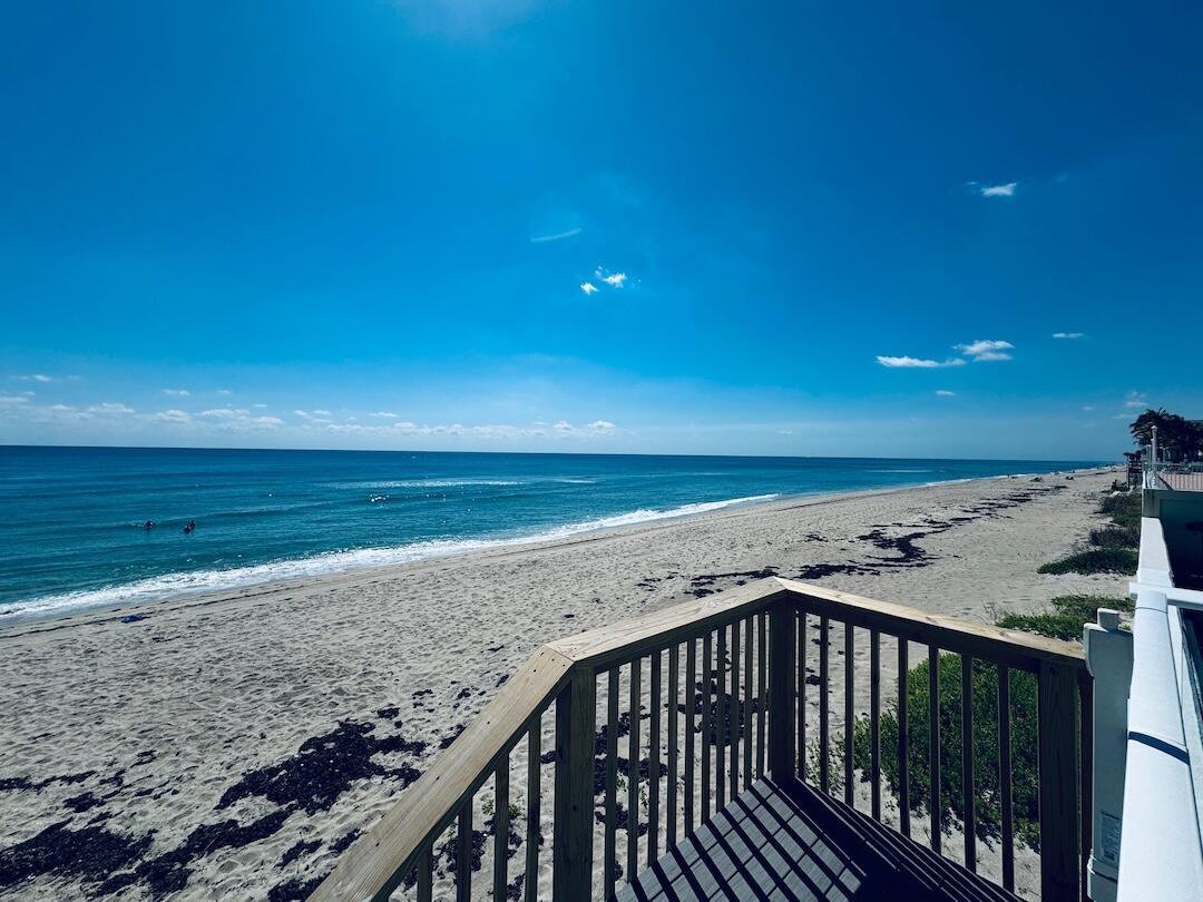 A wooden staircase leads from a deck directly onto a sandy beach by the ocean — 3450 S Ocean Boulevard # 5030, Palm Beach FL 33480, PALM BEACH, FL