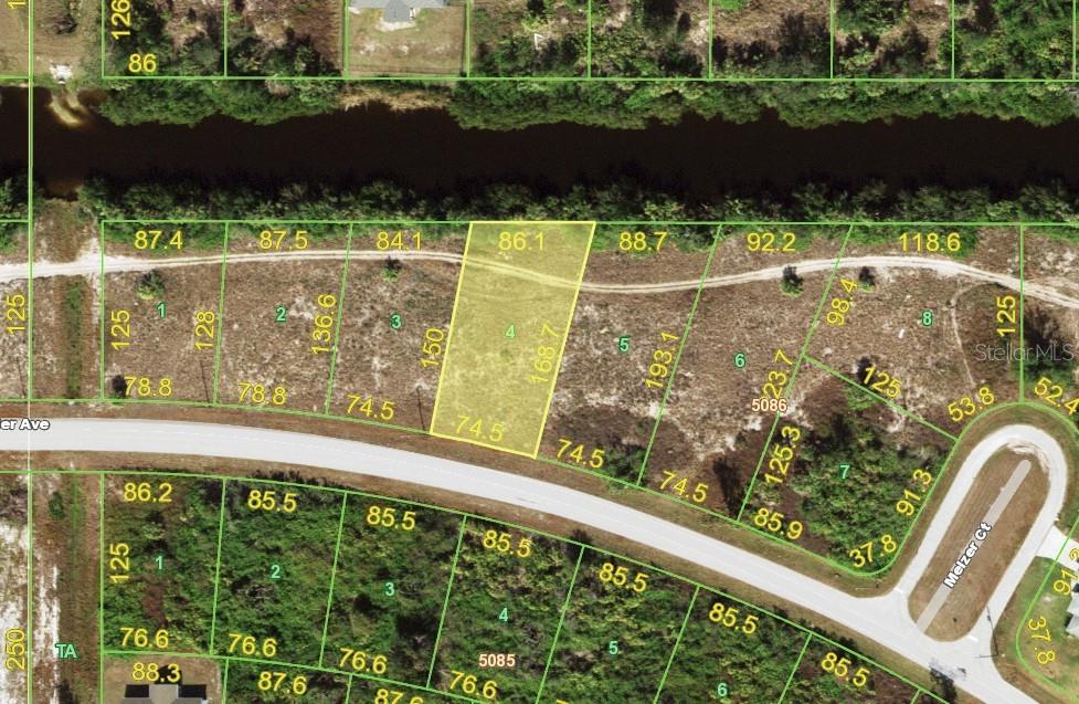 This is a map showing a highlighted vacant lot with property dimensions and surrounding parcels — 13032 XAVIER AVENUE, PORT CHARLOTTE, FL