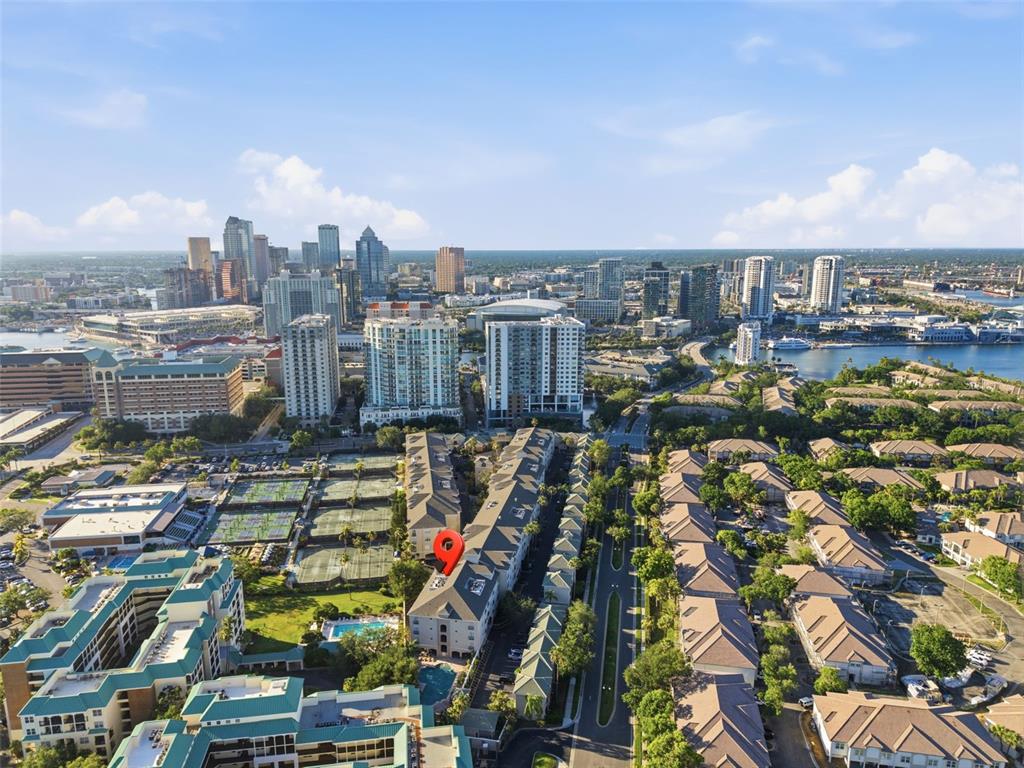 An aerial view shows a multi-story residential building marked with a pin near downtown Tampa — 501 KNIGHTS RUN AVENUE UNIT 1332, TAMPA, FL