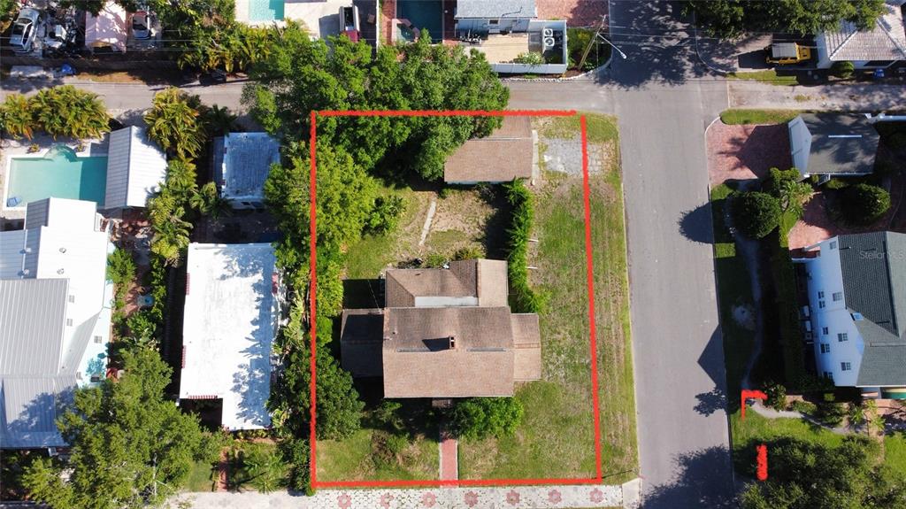 An aerial view shows a house and a detached garage on a rectangular lot — 255 19TH AVENUE NE, ST PETERSBURG, FL